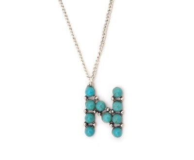 Letter "N" made of turquoise colored semi-stones on a simple chain